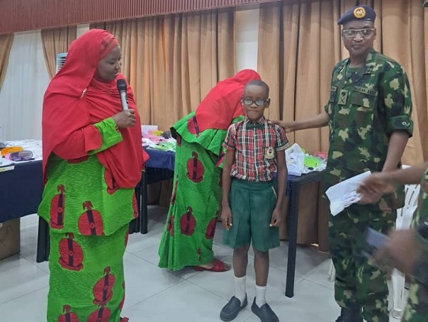 Maj. Gen. Tsoho Presenting Medicated Glasses to One of the recipients