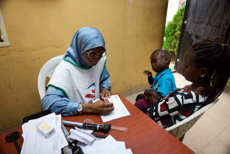 Dr. Akinremi Attending to a Child