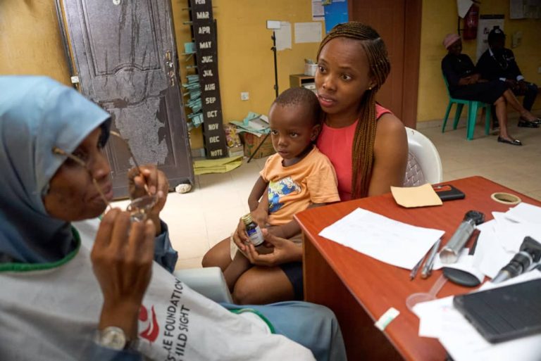 Dr. Akinremi Attending to a Child_