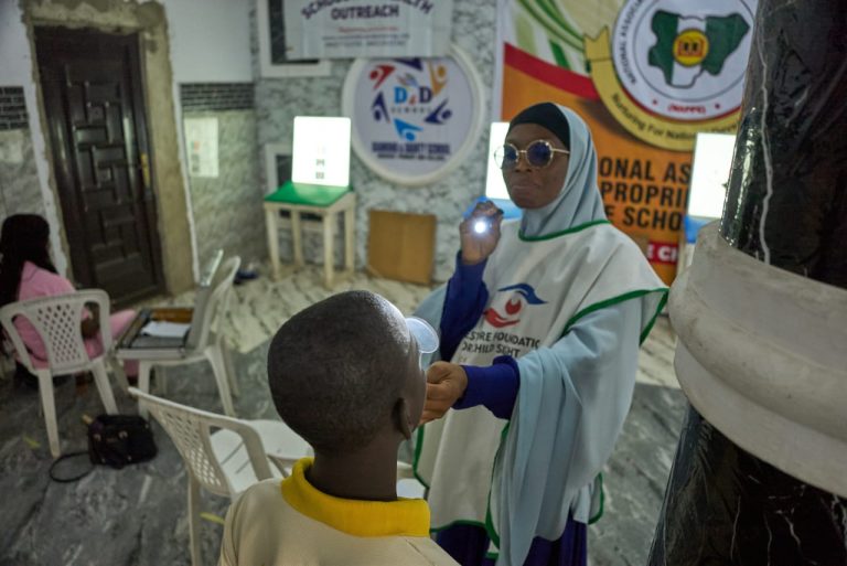 Dr. Akinremi attending to a Student