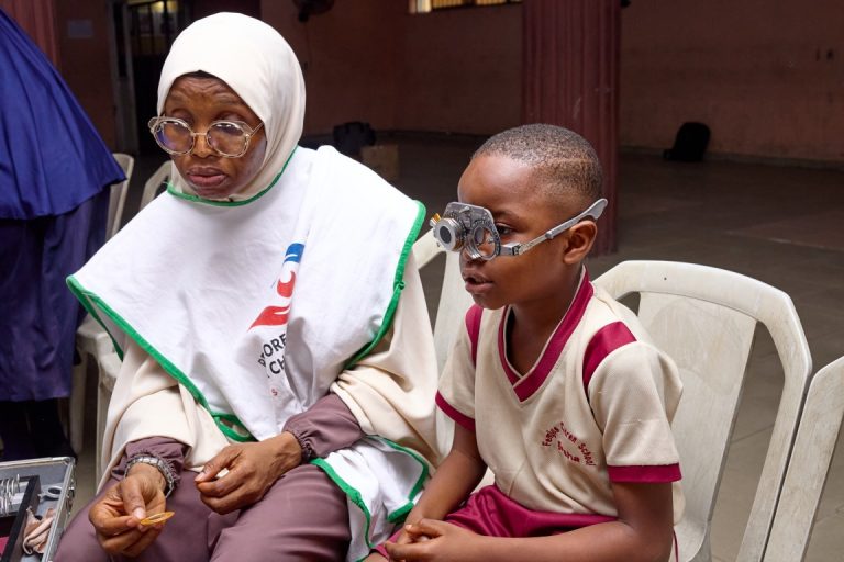 Dr. Akinremi Conducting Vision Screening