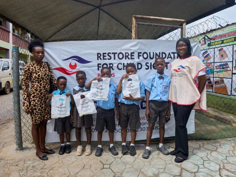 A member of Team restore and One of the Schools