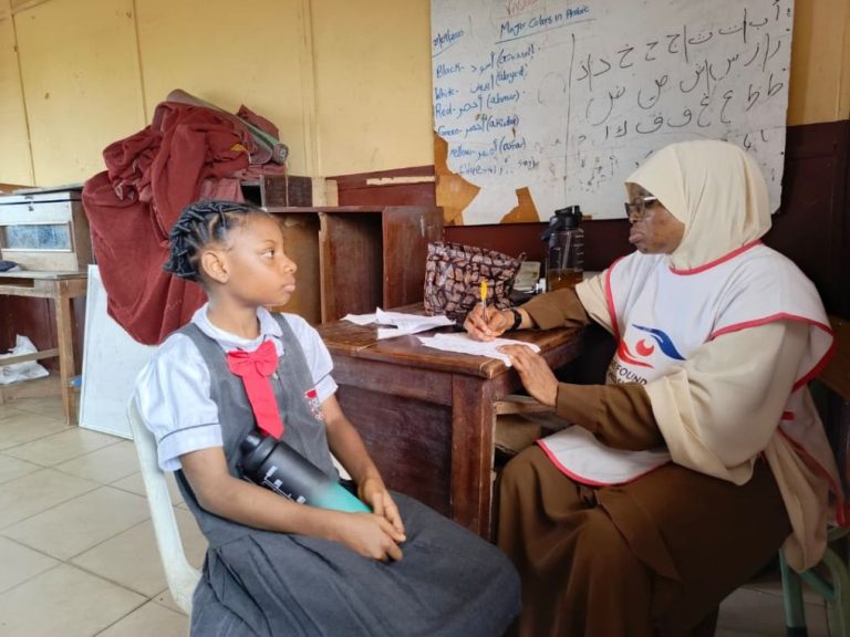 Dr. Akinremi Attending to a Student