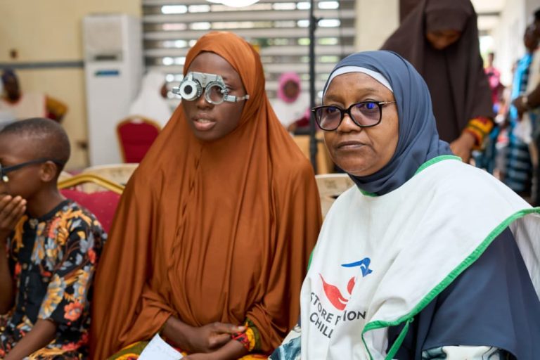 Dr. Alimi Doing Vision Screening
