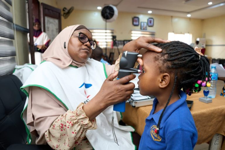 Dr. Alimi Screening a Child