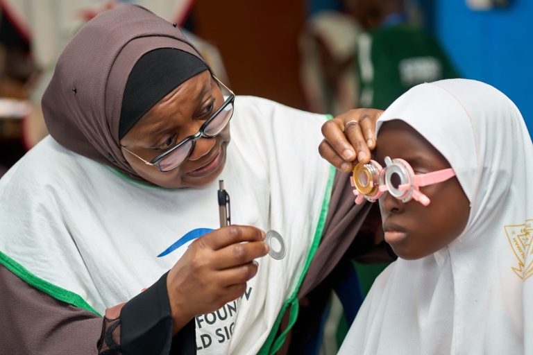 Dr. Alimi Screening a Student