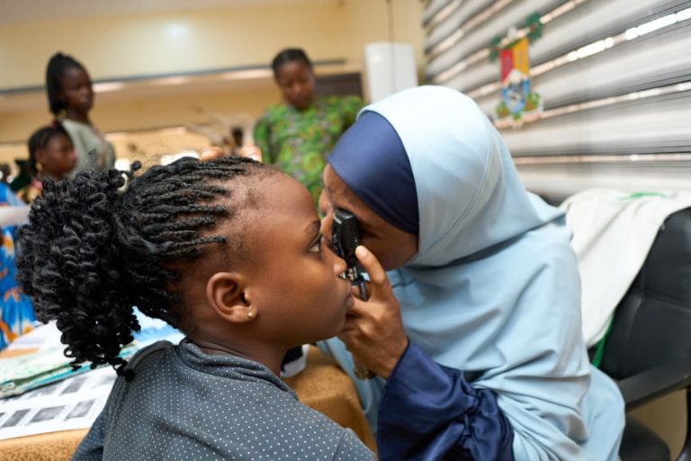 Getting Her Eyes Checked at The Outreach