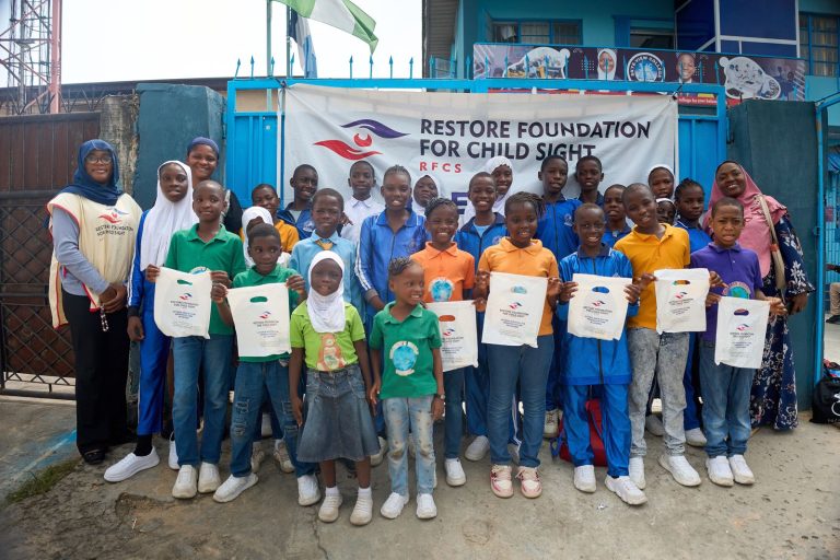Team Restore and Students with their Free Medicine