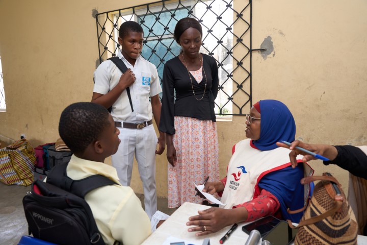 Dr. Alimi Attending to Outreach Participants
