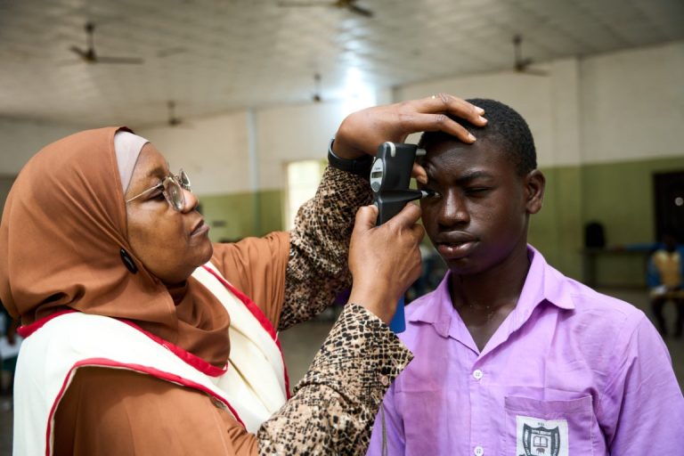 Dr. Alimi Carrying Out Vision Screening
