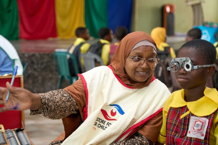 Dr. Alimi Working With a Student