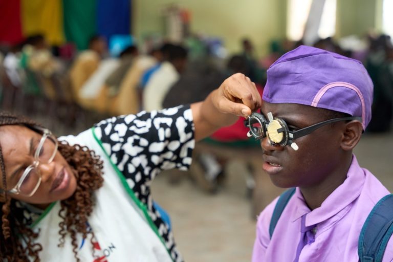 Optometrist Working With a Student